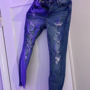 distressed skinny jeans by fashion nova